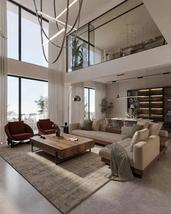 This double-height living room in a Pune penthouse was designed to feel grand yet inviting. I used a neutral palette and minimalist forms to emphasize the scale and light, while the dramatic chandelier and natural textures create a space that is both modern and full of character.
