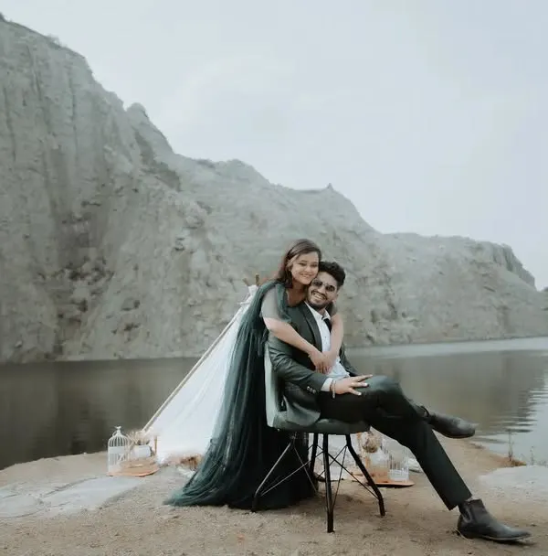 A dramatic, high-fashion pose against the stunning backdrop of a quarry lake. We love finding unique locations for pre-wedding photography that make your photos stand out.