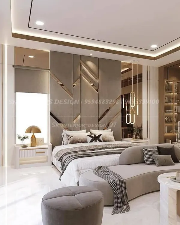 A masterclass in luxury bedroom design, this space features a stunning geometric headboard with integrated lighting and mirrored panels. A curved chaise lounge at the foot of the bed and a dedicated study corner make this room both opulent and highly functional.