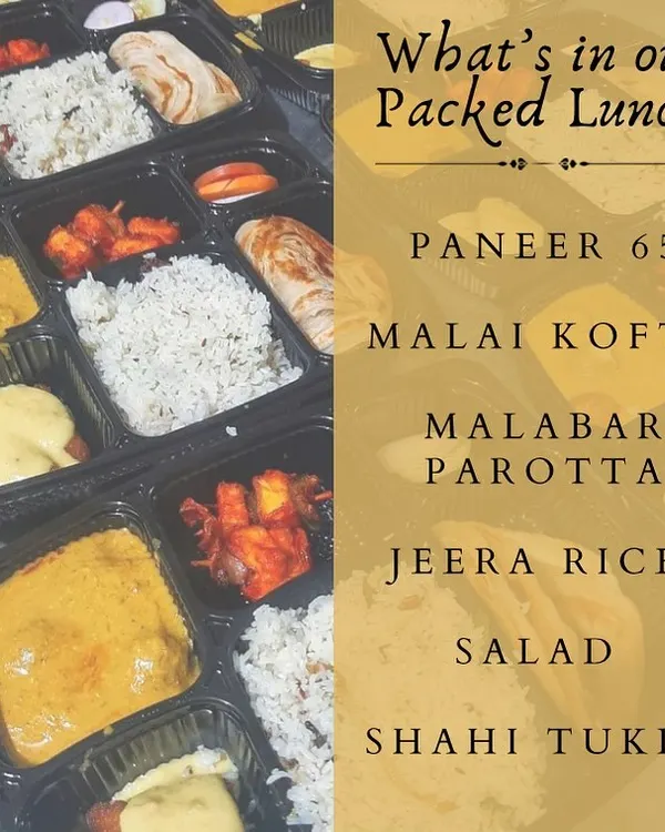 A look inside our packed vegetarian lunch box. This meal includes Paneer 65, Malai Kofta, Malabar Parotta, Jeera Rice, Salad, and a delicious Shahi Tukda for dessert.
