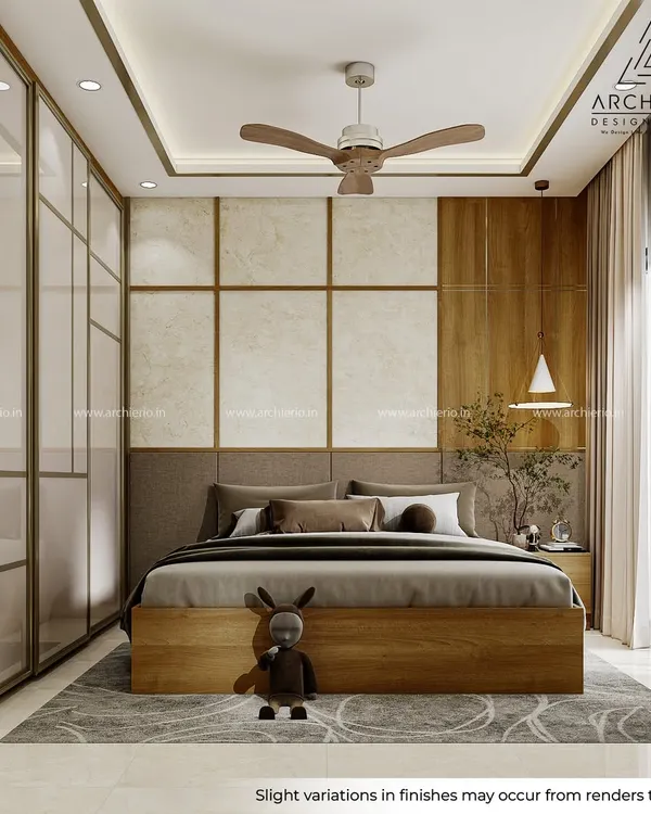 This master bedroom is a study in texture and warmth. The design combines a fabric headboard, wallpaper, veneer beading, and brushed gold accents to create a layered and luxurious feel.