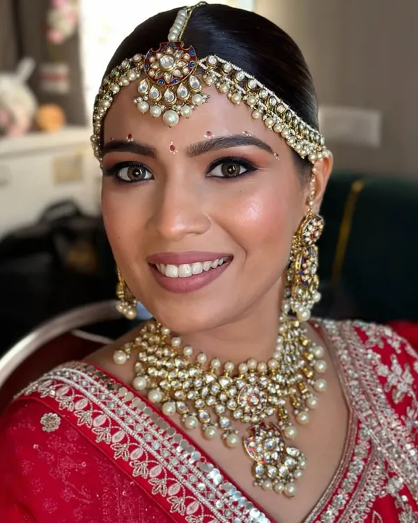 My philosophy is "less is luxury." I focus on creating a radiant, skin-like finish that enhances your natural beauty, ensuring you look and feel like the most timeless version of yourself on your wedding day.