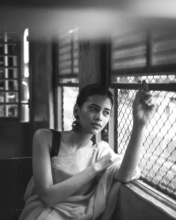 A moment of thought by the window of a Mumbai local. The unique light and movement inside the train create a perfect setting for introspective and cinematic portraits.