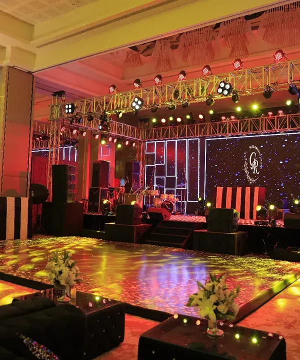 This Sangeet night was all about glamour. We designed a massive stage with a professional lighting rig, an LED backdrop for custom graphics, and a glossy dance floor, creating the perfect setup for a night of spectacular performances.