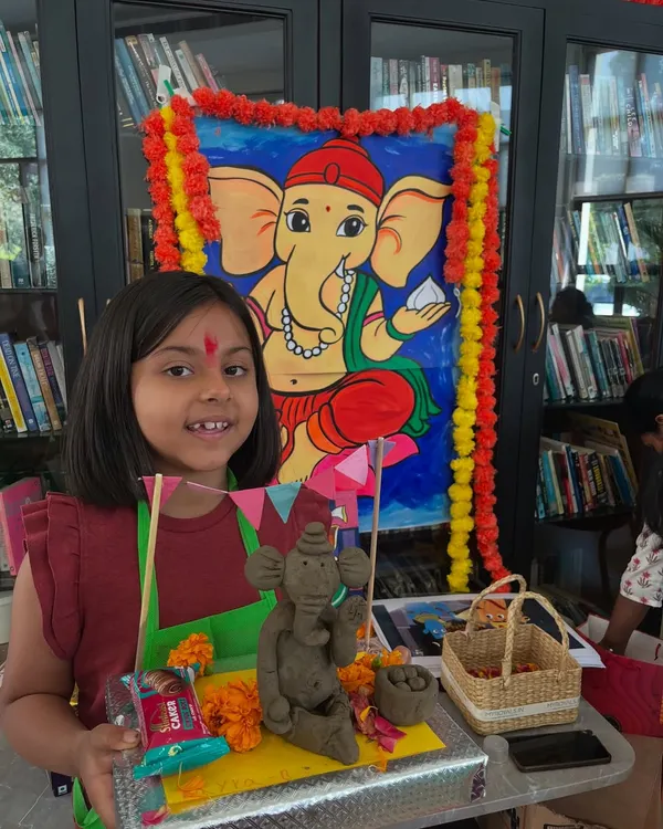 A proud young artist with her eco-friendly Ganesha idol. In our workshops, we teach kids how to sculpt with clay and celebrate festivals in a sustainable way.