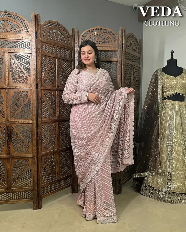 This dusty pink sequin saree is the definition of elegance. The full-sleeve blouse adds a modern touch.