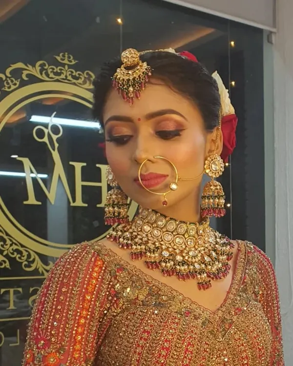A stunning bridal makeup look. I focused on radiant skin, dramatic eyes with a touch of shimmer, and a bold lip to create a timeless and photogenic result for her wedding day.