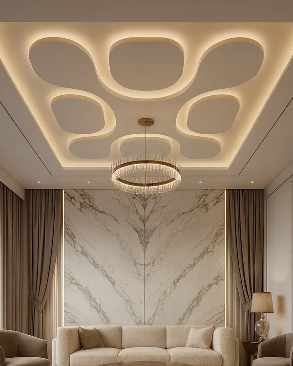 This is how we turn a simple ceiling into a statement piece. This gypsum false ceiling design for a living room uses organic, curved cutouts with integrated cove lighting to create a soft, luxurious glow. It's a perfect example of modern ceiling architecture that adds depth and elegance.