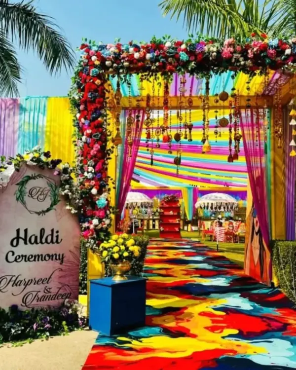 This vibrant Haldi ceremony entrance is all about making a joyful first impression. I used a kaleidoscope of colorful drapes, a custom welcome sign, and lush floral arrangements to create an immersive and festive atmosphere for the guests.