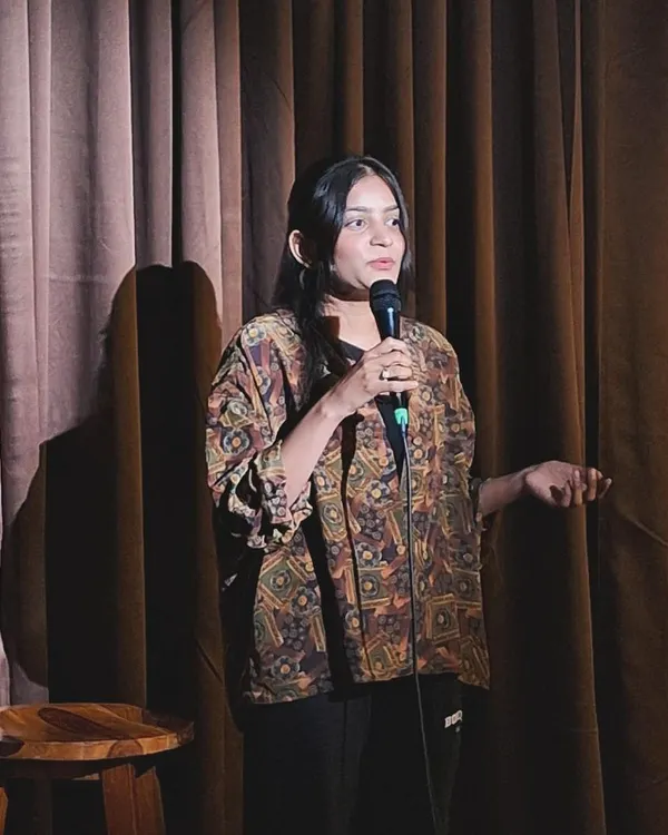 On stage with the microphone, sharing a piece of my poetry. This is where I express the emotions that fuel my fight for justice.