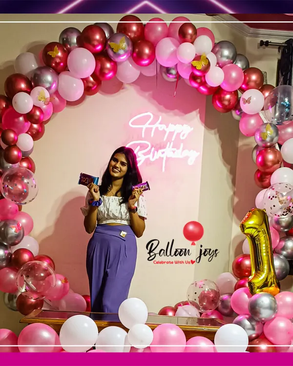 It brings me so much joy to see clients enjoying the backdrops we build. This full circular arch in pink, red, and silver, complete with a neon sign, created the perfect photo-op for this birthday celebration.