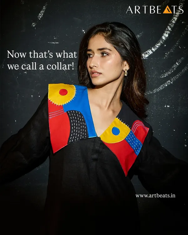 Now that's what we call a collar. This black linen dress features an oversized, hand-detailed collar with my bold, abstract artwork, turning a simple silhouette into a true statement piece.