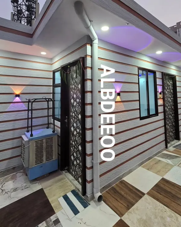 A beautifully finished rooftop porta cabin with stylish exterior cladding and modern wall-mounted lights. This project shows how our structures integrate seamlessly with existing buildings, creating a premium look.