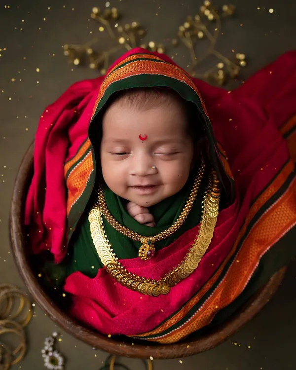 A divine smile for Ganesh Chaturthi. This little one, dressed in a traditional Maharashtrian style, is a perfect picture of festive joy and innocence.
