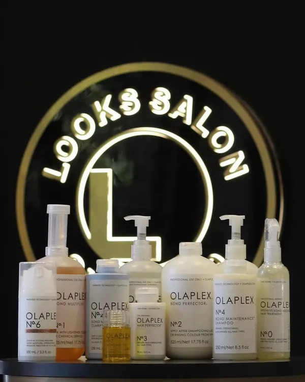 The full professional Olaplex lineup at our salon. From the in-salon No.1 and No.2 steps to the take-home maintenance products, we have everything needed to rebuild and protect your hair.