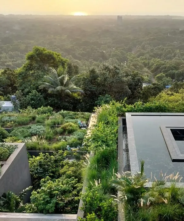 At Villa Toshi, the landscape is the architecture. We recalibrated an existing structure by adding extensive rooftop gardens and lush planting that cascades down the building, effectively merging the home with the hillside and the expansive view.