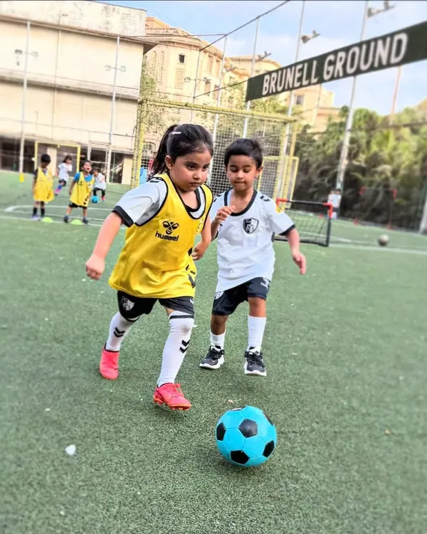 Dribbling with determination at our Brunell Ground facility. We provide our youngest players with the right gear and guidance to start their football journey confidently.
