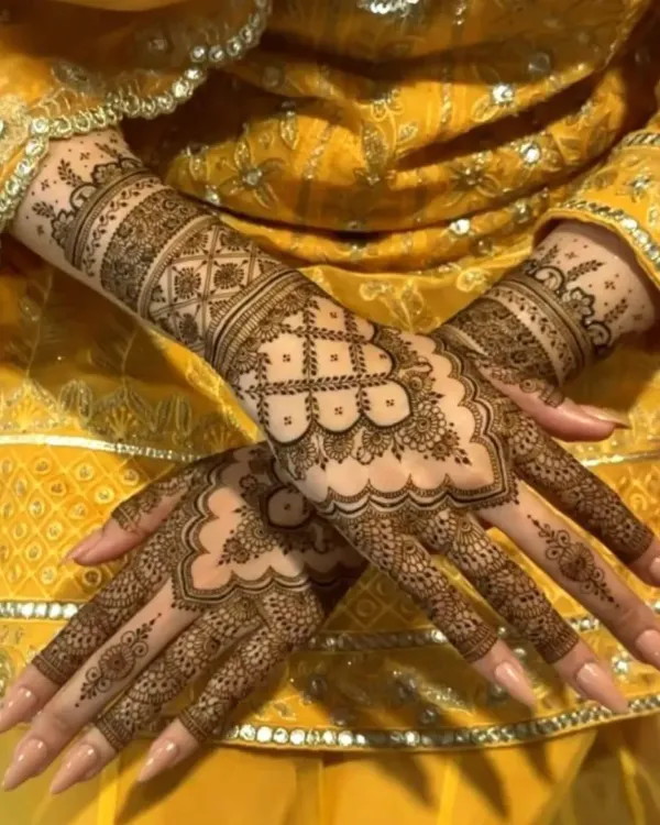 A beautiful design for the back of the hands, featuring intricate jaali work and delicate floral borders.