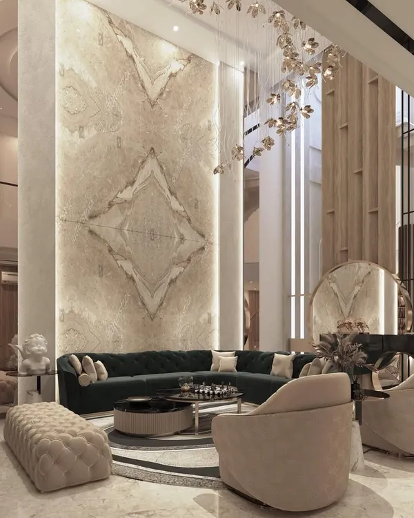 This double-height living room is a signature of my design approach, creating a sense of grandeur and space. The book-matched Italian marble wall serves as a monumental art piece, complemented by a cascading chandelier and bespoke furniture that balances scale with comfort.