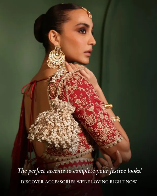The perfect accents to complete your festive looks. This beautiful potli bag with pearl tassels will add a touch of elegance to any saree or lehenga.