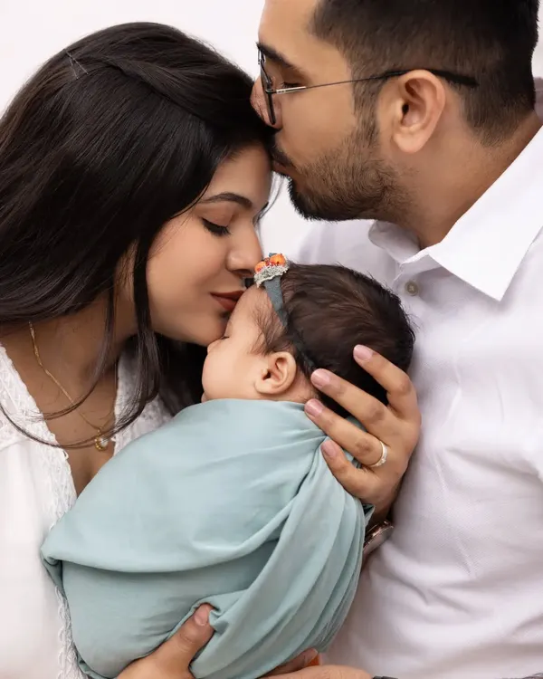 The first days as a family are so precious. We focus on capturing the deep connection between parents and their newborn in intimate, close up shots like this.