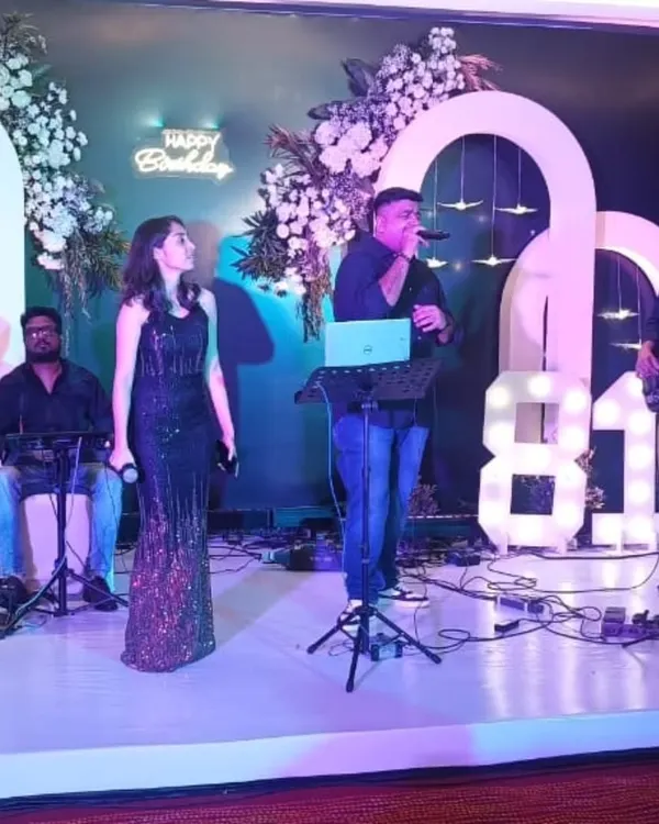 A full view of our live band performing at an 81st birthday party. The setup includes our talented male and female singers, a keyboardist, and a guitarist, creating a rich sound perfect for milestone celebrations.