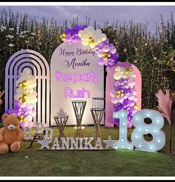 For Annika's 18th birthday, I designed this elegant outdoor setup with a purple and white color scheme. The decor features modern arched backdrops, soft balloon arrangements, and large marquee numbers to mark the special milestone.