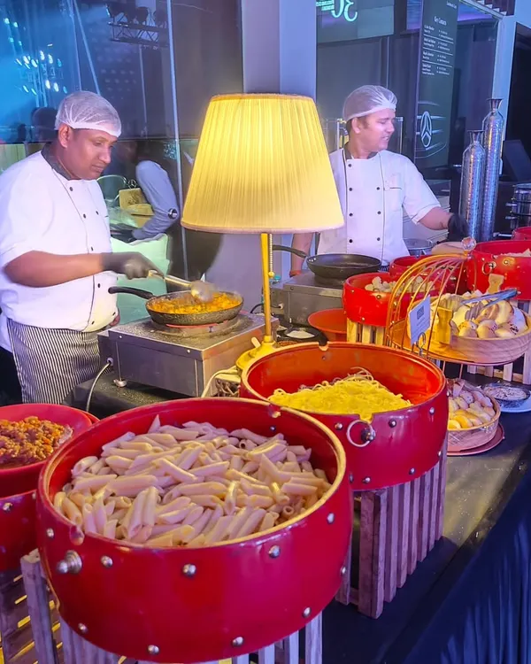 Our chefs preparing customized pasta dishes at a live station for the Mercedes EQ launch. Guests can choose their own pasta, sauce, and toppings, ensuring a fresh and personalized meal cooked right before their eyes.