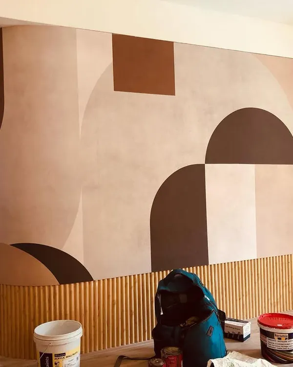This large-scale abstract mural features bold geometric shapes in earthy tones. I installed it on a curved wall with wainscoting, requiring precise cuts for a perfect fit.