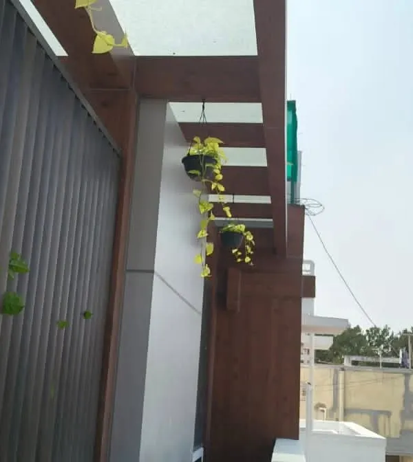 To make the most of a small balcony, I use vertical space. These hanging baskets add a beautiful trailing element of green without taking up any floor space, drawing the eye upward.