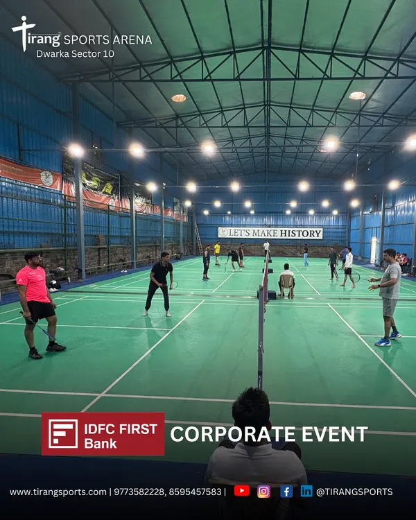 A wide view of our Dwarka Sector 10 arena during a corporate event for IDFC First Bank. We have the capacity to host large groups across multiple courts for company-wide sports tournaments.