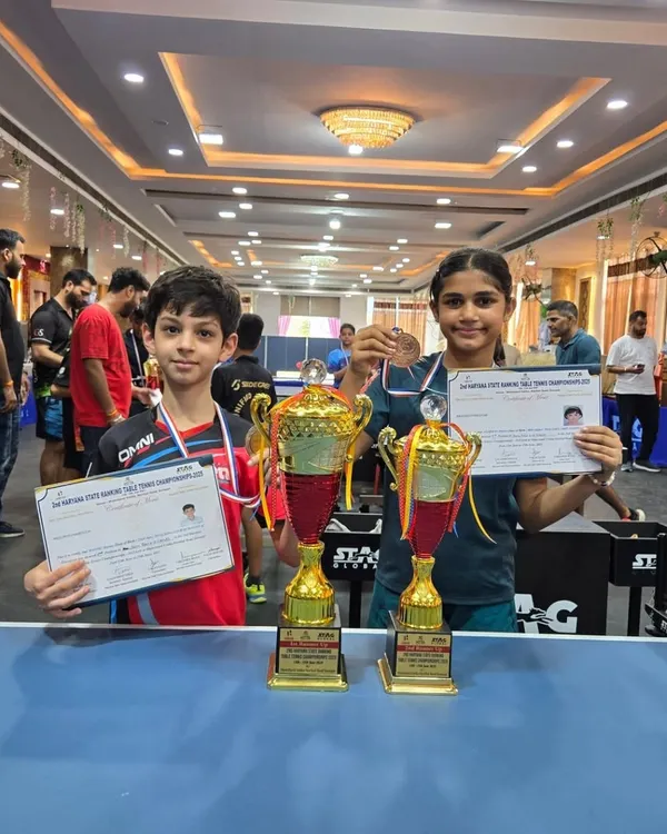 This is what dedication looks like. I am incredibly proud of Manan Magoo and Prisha Agarwal, showcasing their trophies after a brilliant performance at the Haryana State Ranking Table Tennis Championship. Their success is a testament to their hard work in our youth coaching program.