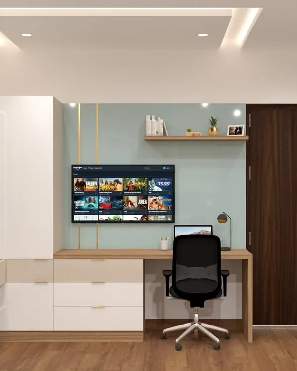 This custom-built unit seamlessly combines a study desk, a TV entertainment area, and a dressing table with storage. The light wood and white finish keeps the design feeling bright and uncluttered.