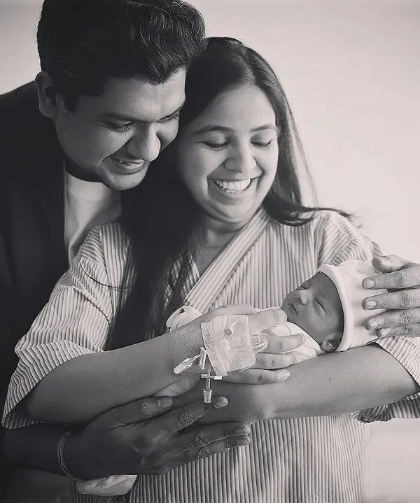 The pure joy on these new parents' faces says it all. This black and white hospital photo captures a candid, emotional moment just after their baby's arrival. These Fresh 48 sessions are all about documenting the real feelings of this special time.