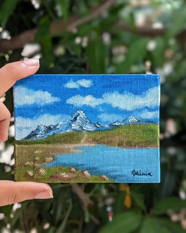 This little painting holds a big memory for me, the stunning Chandrataal Lake from my trip to Spiti Valley. I used oil paints on a tiny 3x4 inch canvas to capture the bright blue sky and the snow on the mountain peaks. It feels amazing to hold a whole landscape in my hand.
