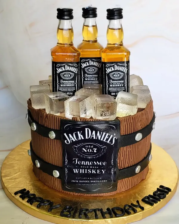 What more do you need? A Jack Daniel's barrel cake, complete with miniature whiskey bottles and edible ice cubes. This is the perfect cake for a whiskey lover.