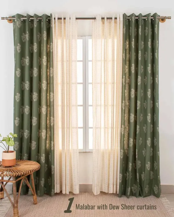 Our Malabar print curtain in a deep green is paired with a Dew Sheer curtain. This best-selling combination offers a rich, earthy look while the sheer layer keeps the space from feeling too dark.