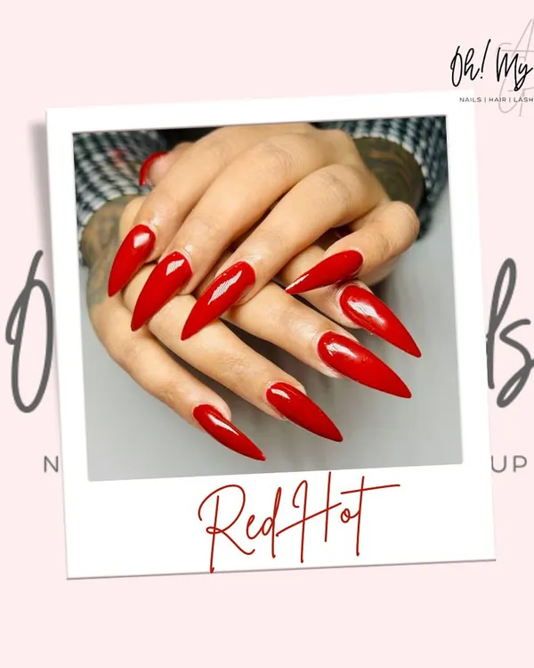Sometimes, a single colour makes the boldest statement. This set features dramatic, long stiletto nails coated in a vibrant, glossy red polish.