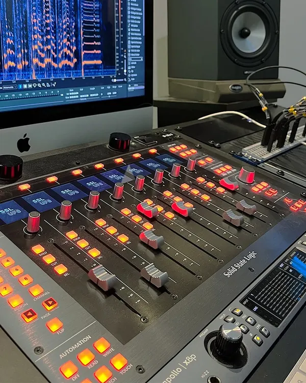 A full view of our mixing console, featuring the Solid State Logic UF8 Control Surface paired with the Universal Audio Apollo X8P. This setup offers precise, hands-on control over your mix and pristine audio quality.