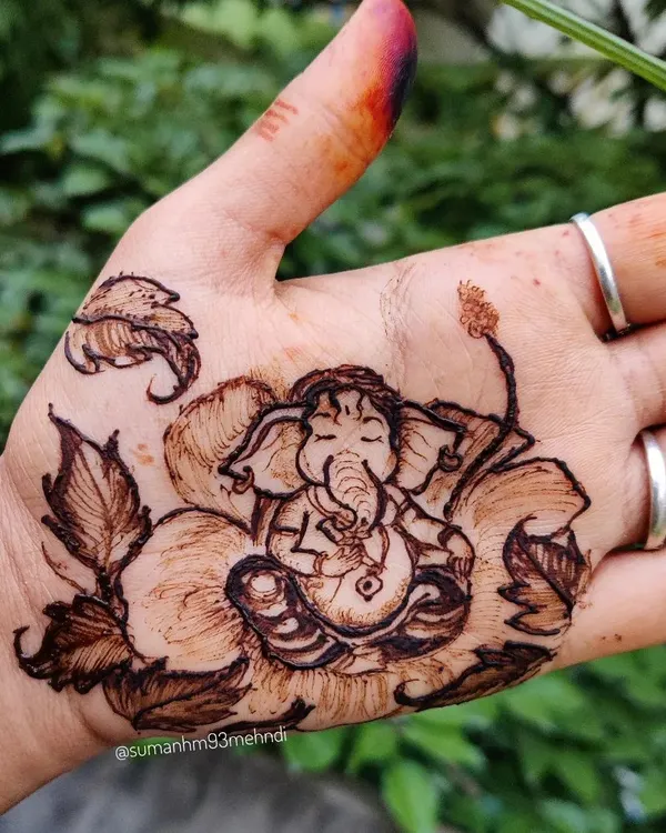A peaceful Lord Ganesha resting on a hibiscus flower, a popular design for Ganesh Chaturthi. This simple yet detailed portrait is perfect for celebrating the festival.