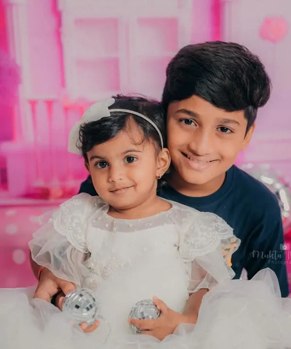 A sweet moment between a big brother and his little Barbie sister. Sibling photos are a wonderful addition to any birthday shoot.