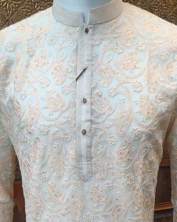 The beauty of fine threadwork on a kurta. This piece features delicate paisley and floral embroidery in a subtle, contrasting color, perfect for an elegant and understated look.