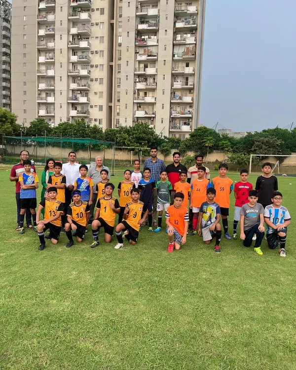 A group photo with both teams after our U-11 friendly match. Competing against other academies helps our players grow and builds sportsmanship.