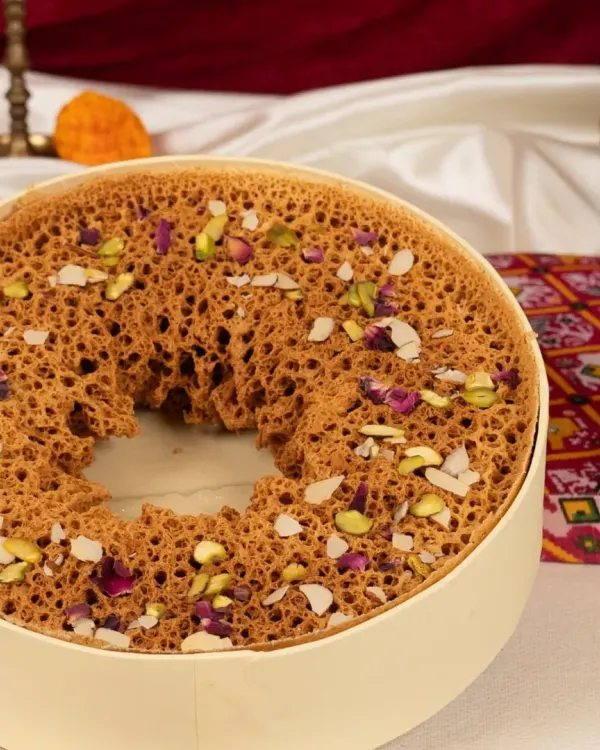 My signature Paneer Ghewar, a masterpiece of texture and flavour. This iconic Rajasthani dessert is perfect for festivals like Teej and Raksha Bandhan, or any grand celebration.