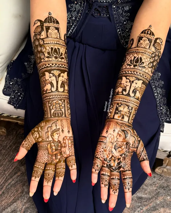 This is the level of artistry I aim to teach. This full bridal mehendi includes detailed portraits of the couple, traditional elephant motifs, and lotus patterns, covering both hands up to the elbows.