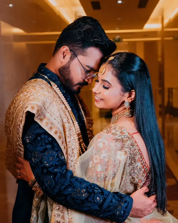 An intimate embrace, capturing the deep connection and romance between the couple. The soft lighting and their close posture create a timeless and emotional portrait.