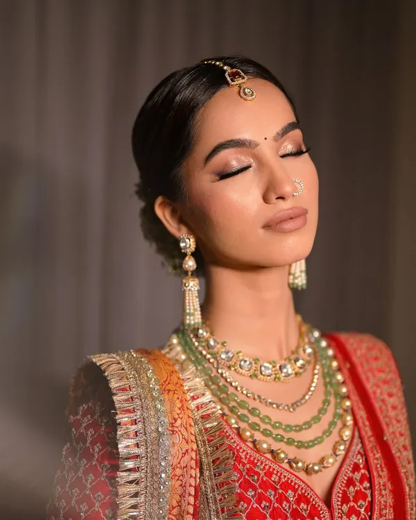 A close-up showcasing the detailed eyeshadow work for a bridal look. I used a palette of warm, shimmery tones and a subtle winged liner to create a romantic and elegant effect.