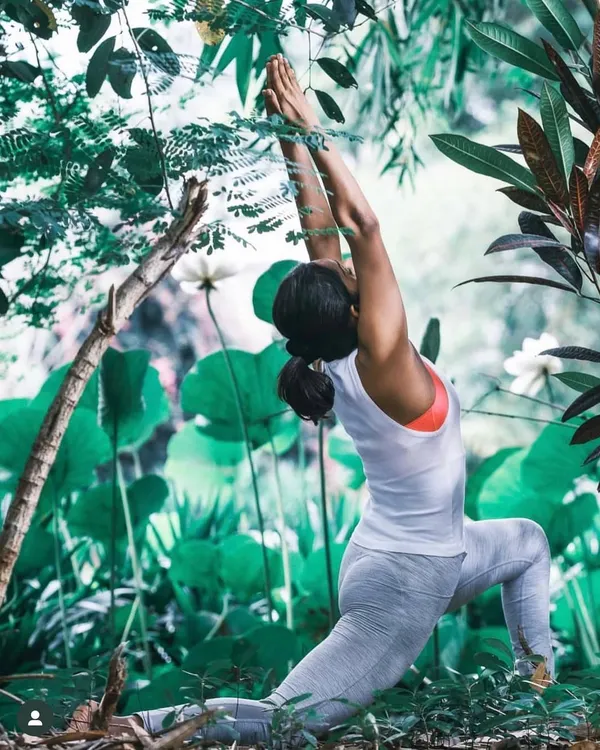 This is the heart of my practice: connecting with nature, finding grace, and breathing into the moment. Here in a lush green space, I'm in Anjaneyasana, or the low lunge pose, feeling the earth beneath me and the sky above.