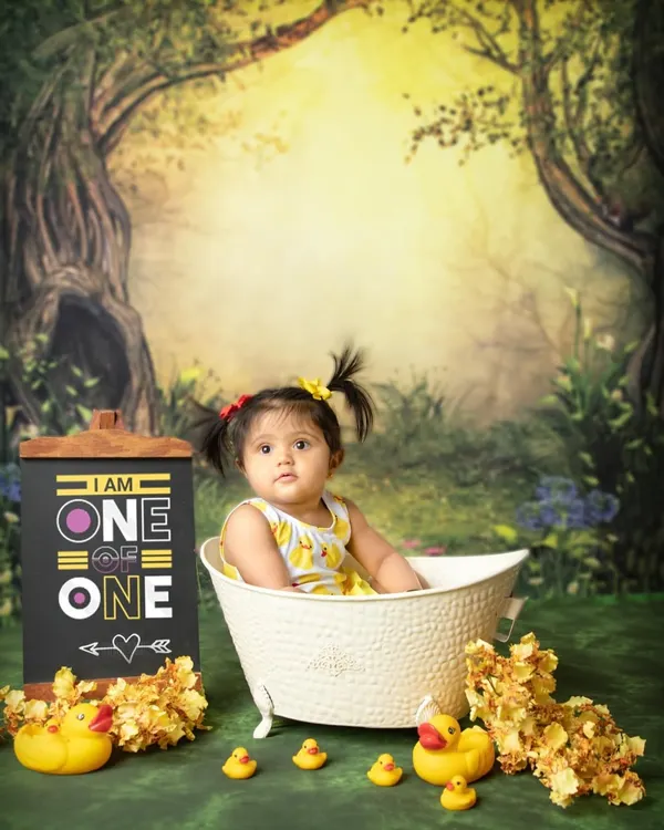 This little girl's mom requested a duck theme for her bath session, as they are her favorite toy. I created an enchanted forest setting for this little duckling to enjoy her splashy celebration.