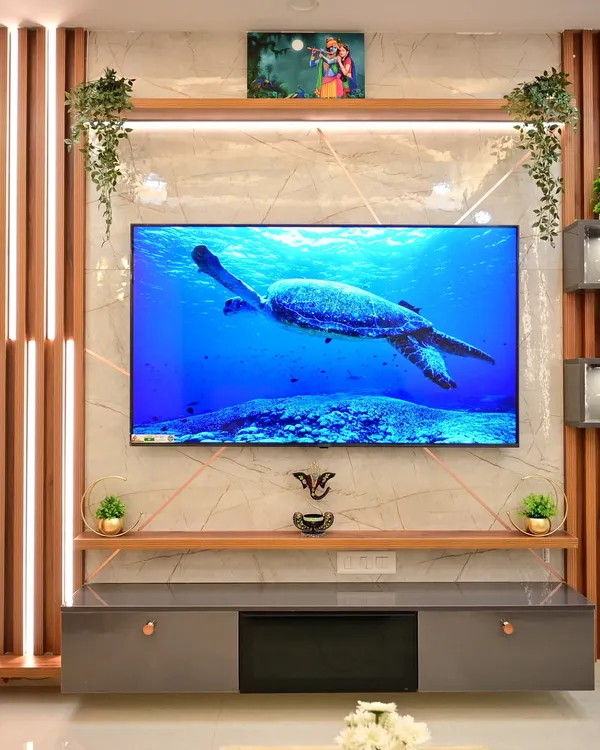 A centerpiece for your living room. This modern TV unit combines sleek marble-finish panels, warm wood accents, and integrated LED lighting to create a sophisticated focal point. The design includes both open shelves for decor and closed cabinets for clutter-free storage.